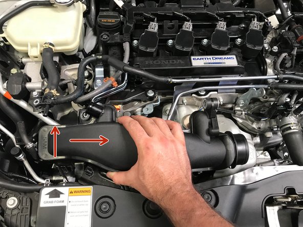 Lower the TIP into the engine bay with the TIP rotated towards the front of the car