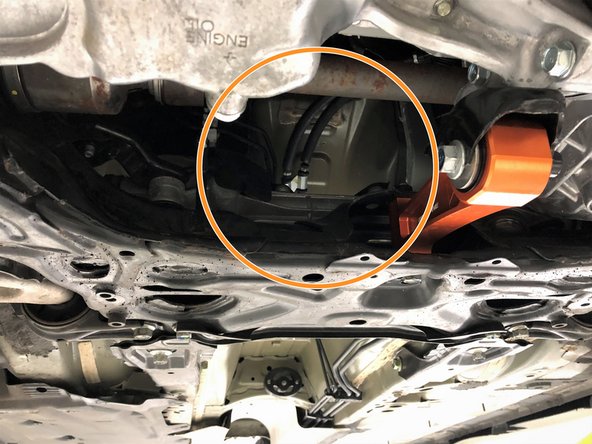 Remove the OE front-pipe from the vehicle through the access point directly under the engine