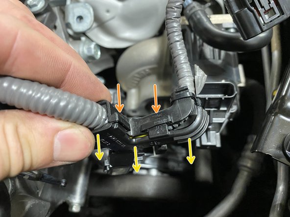 Using a small flat head screwdriver, pry the tabs out