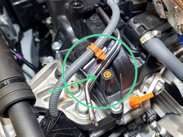 Use 10mm socket and ratchet to remove three (3) bolts shown