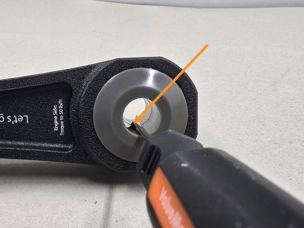 With a flat head screwdriver, press the other piece of poly out