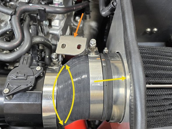 Push the filter bracket off to the side for easy access to the clamps