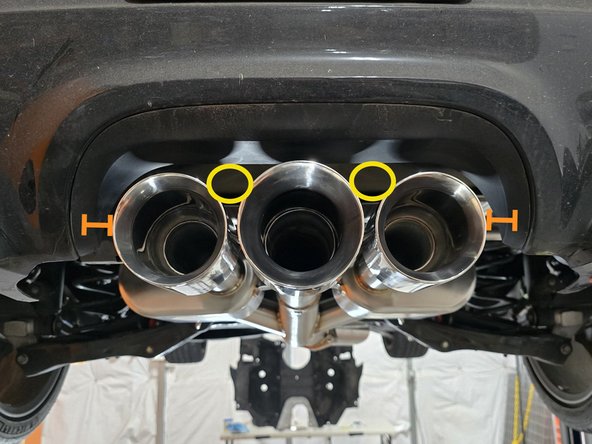 Stand back from the car and verify that the tips are centered and have around 1 inch inch clearance from the bumper on both sides