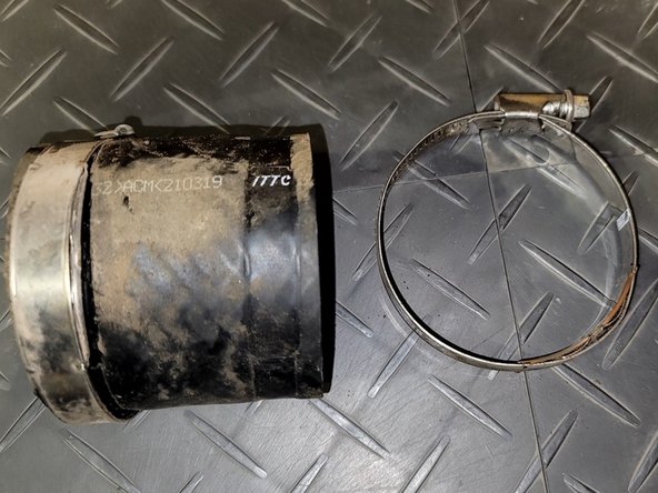 Pull rubber coupler off throttle body