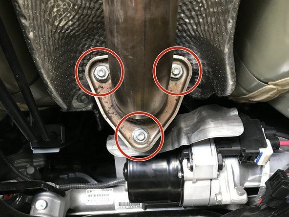 Locate the connection between the front-pipe and down stream exhaust