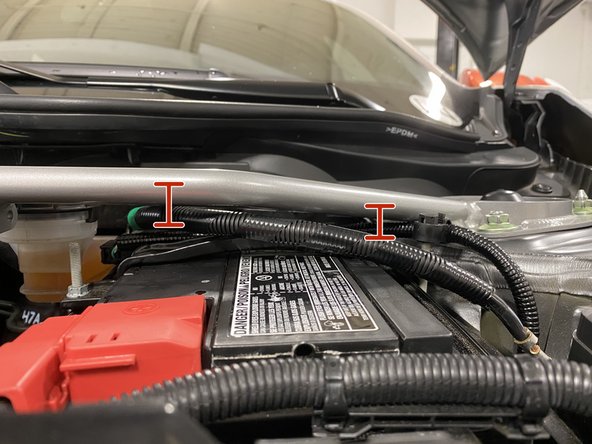 The strut bar sits very close to the battery cable, please verify the cables are not pushing up into the strut bar