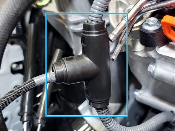 Clip provided Tee in place as shown onto the wiring you uncovered in Step 19