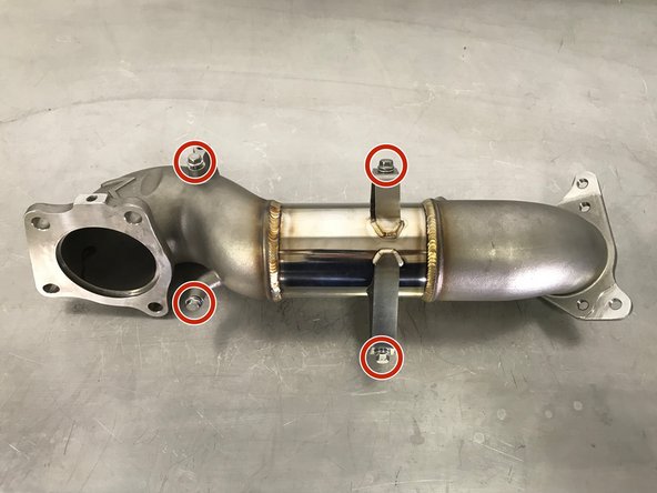 Locate the four (4) provided 10mm flange bolts on the downpipe