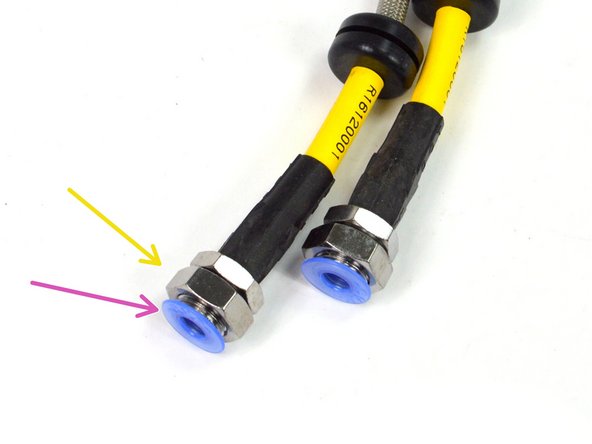 Take one of the provided brake lines and remove the blue plastic dust cover from the brakeline