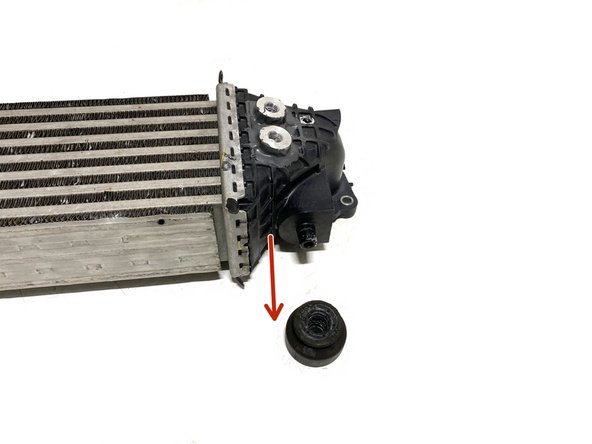 Remove the two (2) OEM rubber mounts from the bottom of the intercooler