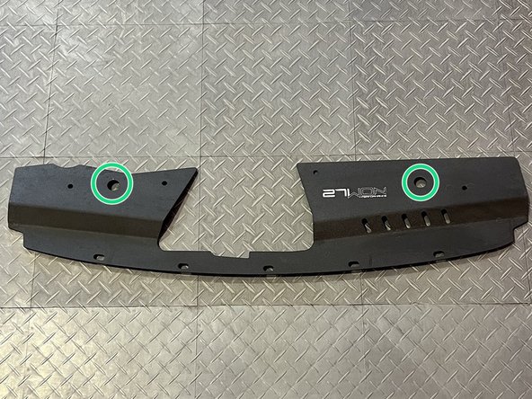 Locate the two large holes in the 27WON shroud. This is where you will install the 2x rubber stops you just removed