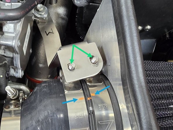 Using a 10mm socket, tighten the 108-116mm clamp over the filter until there is enough threads sticking out to verify position, but still loose enough to rotate the clamp