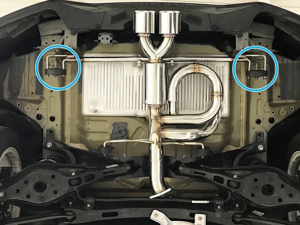 Then raise the rear end of the muffler section up and insert both rearward hangers