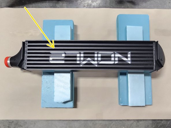 Remove the tape holding the paper to the intercooler