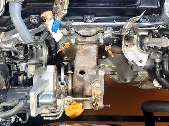 Wiggle turbocharger  as you rotate the assembly off the two studs remaining in the head