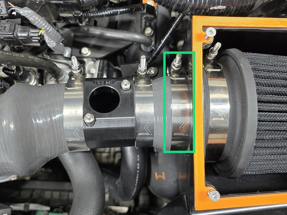 Use the provided 83-91mm T-bolt clamp secure the silicone stack up onto the airbox as shown