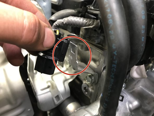 Install the secondary O2 sensor wiring harness onto the bracket