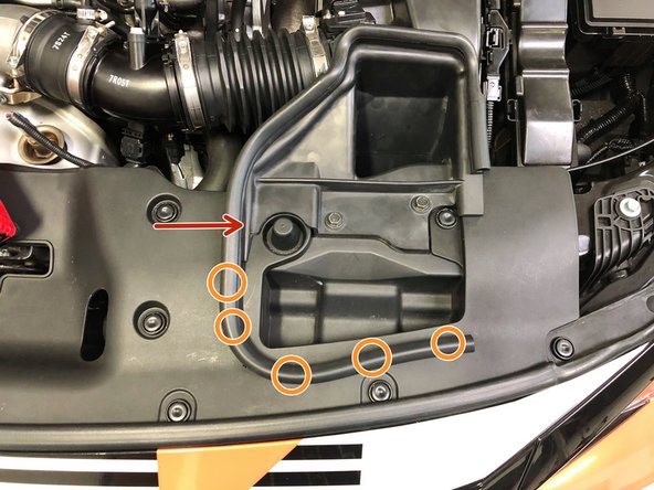 Reinstall the rubber tab in the corner of the OEM air duct onto the upper radiator panel