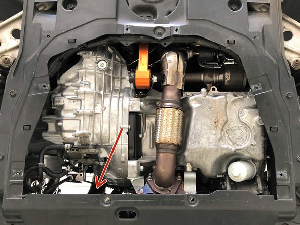 Locate the lower portion of the OEM cold side boost tube. It's in the general area of the red arrow