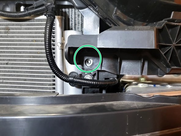 Remove four (4) bolts securing headlight to car using 10mm socket and ratchet