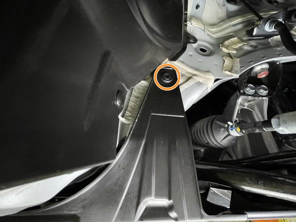 Use a large flat head screw driver or prying tool to remove the four (4) push-clips from each front wheel well