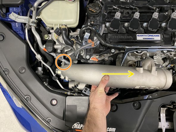 Lower the TIP into the engine bay with the TIP rotated towards the front of the car