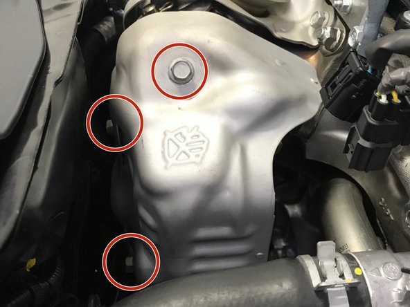 Use a 12mm wrench to install the three (3) 10mm bolts and heat shield.  Torque to 15-19 ft-lbs