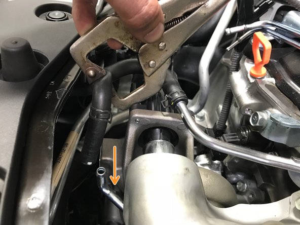 Push the rubber coolant hose onto the turbo upper coolant pipe