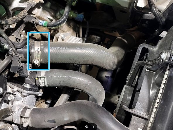 Use 10mm socket and ratchet to loosen clamp at the OE cold pipe