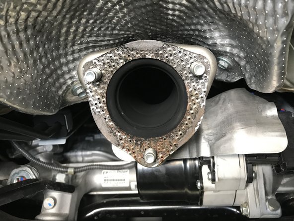 Remove any debris/residue remaining on the OE front pipe