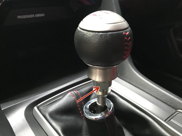 Locate the two flat spots on the OEM locking nut