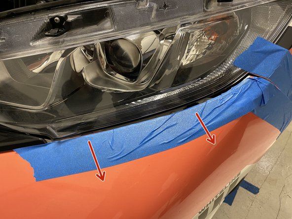 Moving along the headlight, keep pulling outward slightly