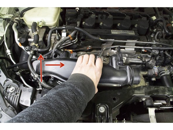 Lower the TIP into the engine bay with the TIP rotated towards the front of the car
