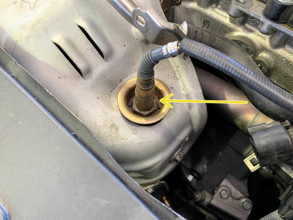 Using a 22mm socket remove the upper oxygen sensor
