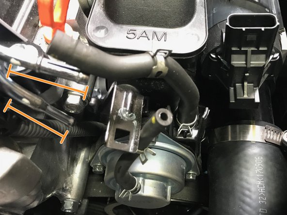 Pull the BPV hoses off the metal tubes in the direction of the orange arrows