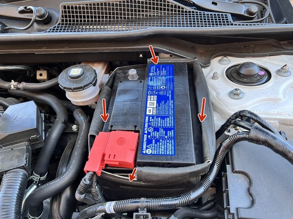 One at a time fold each side of the battery blanket inside towards the battery as shown