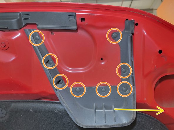 Using a panel clip tool remove eight (8) plastic clips from the intake shroud on the hood