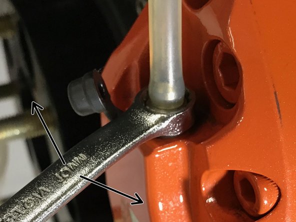 The brake pedal will go to the floor while fluid and air will be pushed through the open bleed screw