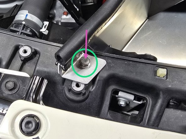 Hand thread the provided 12mm flange bolt through the inlet bracket into the threaded hole shown