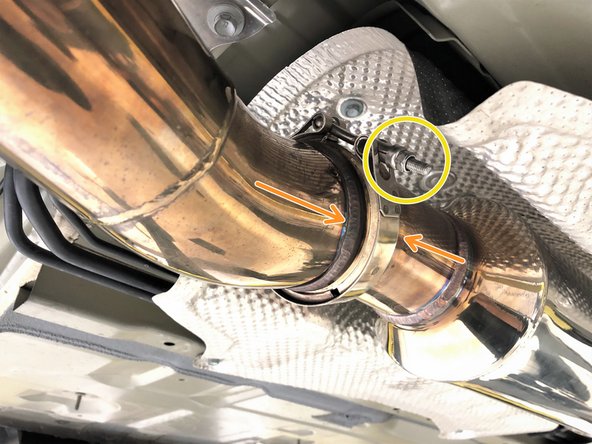 Lift the 27WON rear-midpipe into position, following the orientation shown