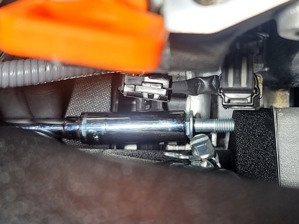 Insert OE bolt into turbocharger as shown using 12mm socket and extension. Tighten to finger tight