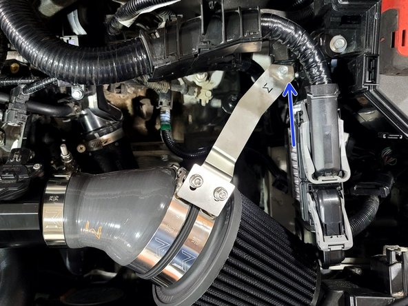 Remove bolt from ECU bracket as shown with 3/8&quot; ratchet, extension and 10mm socket