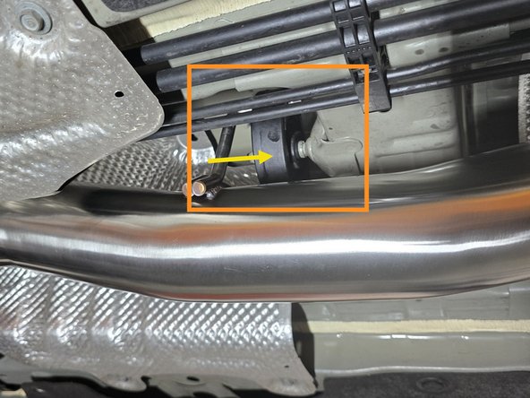 Using a spray cleaner, lubricate the rubber hanger