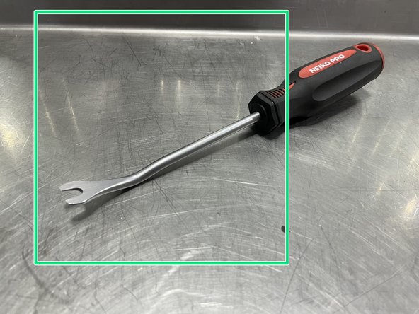 Use a #2 Philips head screw driver to remove  the two (2) Philips pan head screws shown in red circles