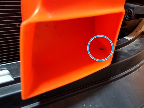 Insert provided plastic clip into bumper as shown