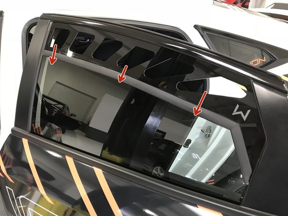 Without moving the window, place your fingers in the vents as shown and push the rubber molding &amp; window vent down slightly to align and fit over the window edge