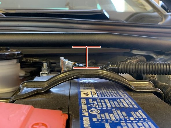 The strut bar sits close to the battery and cables, please verify the cables are not pushing up into the strut bar
