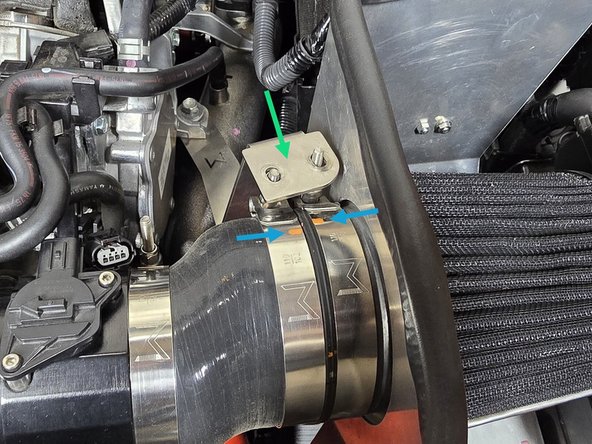 Pull the filter bracket over to check the position of the 102-110mm clamp as shown