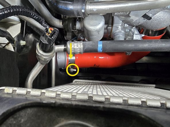 Looking down between the radiator and turbocharger you can get a straight shot at the connection between the hot side boost tube and intercooler