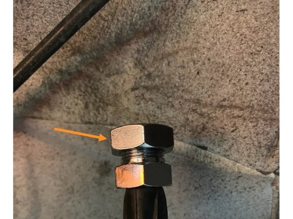 Remove the large 19mm nut from the brake line